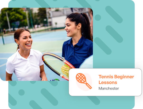 two women holding tennis rackets and smiling